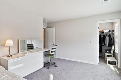 Carpeted office with baseboards