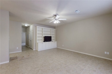Unfurnished living room with baseboards, a ceiling
