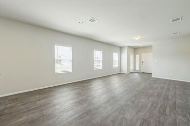Unfurnished living room with dark wood finished f