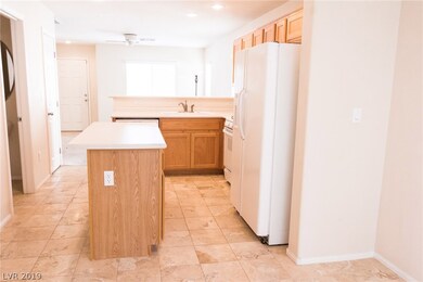 Kitchen looking into the living room and entrance