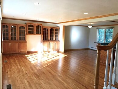 A custom oak entertainment center in the 18x15 liv