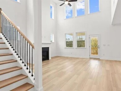 Unfurnished living room with stairs, a glass cover