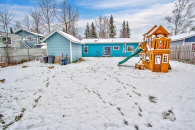 Exterior rear of home and shed