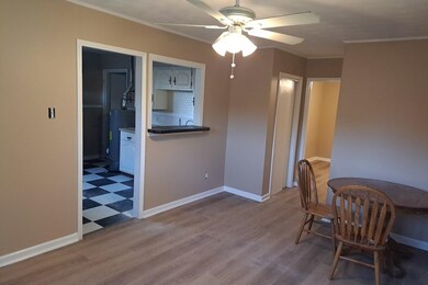 Dining area with ornamental molding, hardwood / wo