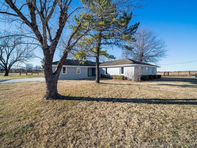 This beautiful home is on one acre, surrounded by