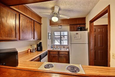 View of the kitchen from the eating bar and living