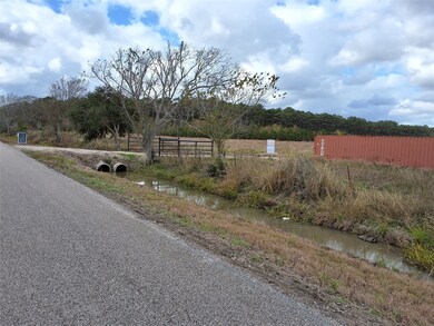 View showing entry driveway over concrete culverts