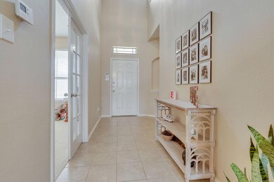 Ceramic-Tiled Entryway.  Through The French Doors 