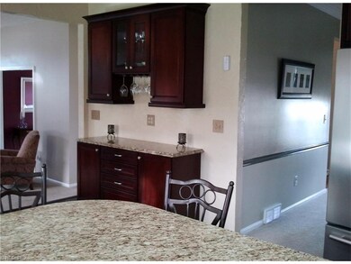 Built-in buffet with granite top and cherry cabine