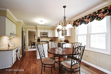 Eating area with hardwood floors.