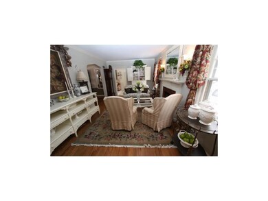 Smooth ceilings, arched doorways, wood floors and 