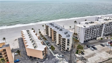 Birds eye view of property with a beach view and a