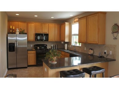Kitchen. Kitchen has solid surface counters, undermount sink, 42
