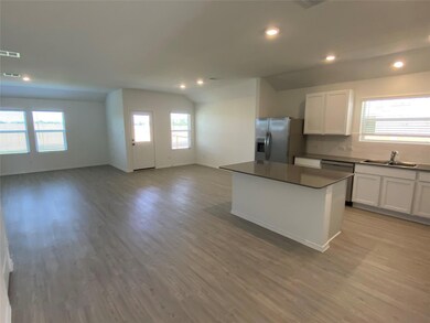Kitchen with stainless steel appliances, open flo