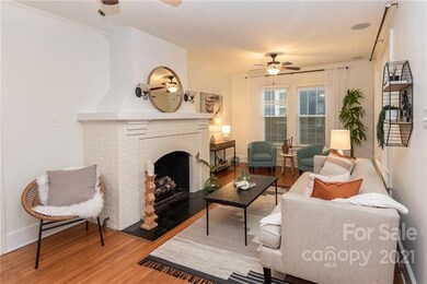 Beautiful, bright living room with oversized firep