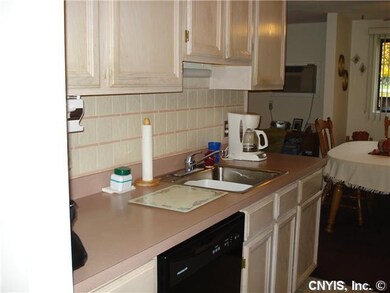 Kitchen showing the cabinets & counter tops & sink