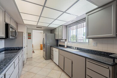 Kitchen in gray and granite