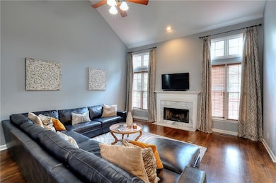 Living room with high vaulted ceiling, a high end 