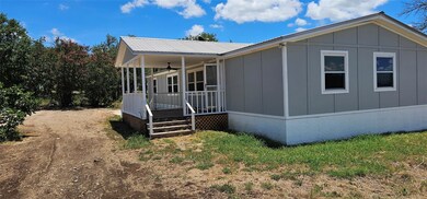 View of front of house featuring board and batten