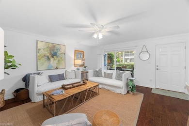 Living room with dark wood-type flooring, ceiling 