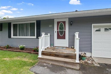 There is a newer window, insulated garage door, st