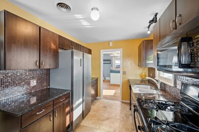 Modern kitchen cabinets, backsplash & granite counters