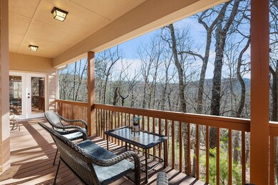 Back covered deck with seasonal mountain views of