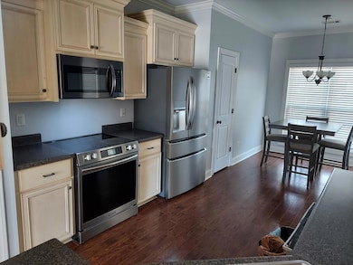 Kitchen with stainless steel appliances with eat i