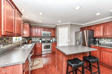 Gorgeous kitchen with center island breakfast bar, large pantry, tons of cabinet space, and stainless appliances!