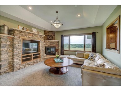 Living room with stone fireplace and built-in's