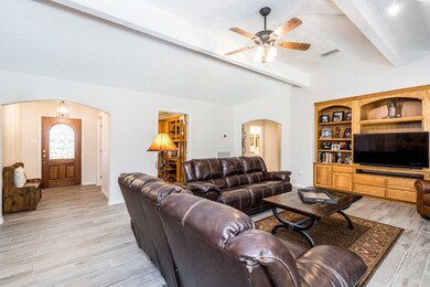 The living area has recent wood look tile.