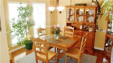 Formal dining:  Bay window, chair rail, hardwood floors.