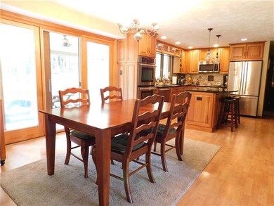 Dining area with Pella sliders out to back covered