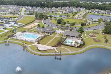 View of property location with nearby suburban area and a nearby body of water