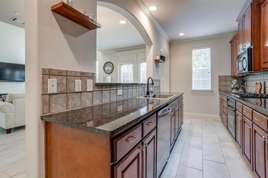 Open-concept kitchen featuring expansive counterto