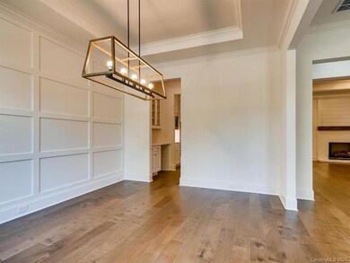 Dining room with ceiling, wall details and upgrade
