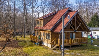 LEFT SIDE OF HOME SHOWING PORCHES SIDE/PARTIAL REA