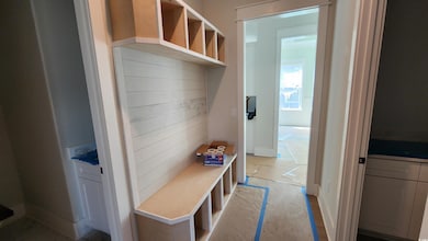 Mudroom featuring baseboards