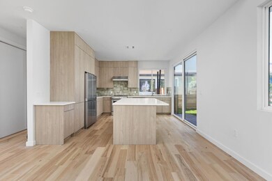 Kitchen featuring stainless steel appliances, lig