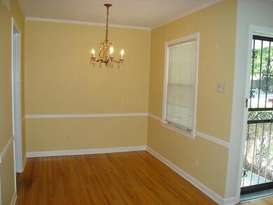 Dining Area Also Features Hardwood, Crown and Chai