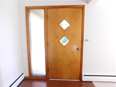 Ribbed, frosted glass accents the birch entry way 