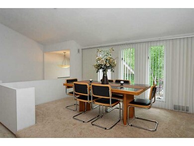 Dining Room. The formal dining room sits on a step