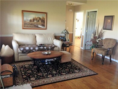 Hardwood floors in great room with high ceilings.  Spacious feel!