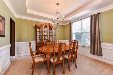 Formal dining room with trey ceiling and beautiful