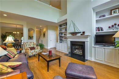 Built in bookcases flank the fireplace and provide useful display and storage areas.