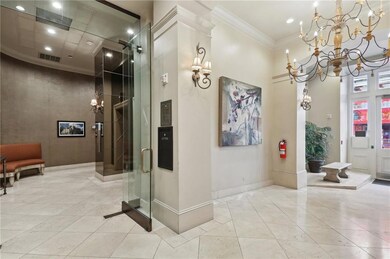Entrance on the right, foyer, and elevator on the