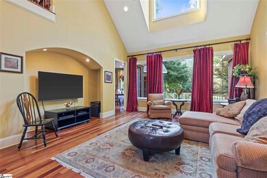 Huge picture windows bathe this room in natural li