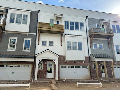 Townhome / multi-family property featuring brick s