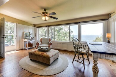 Great room is bathed in natural sunlight dancing a