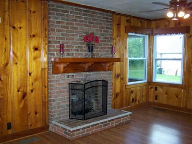 Eating area or dining room with gas fireplace.